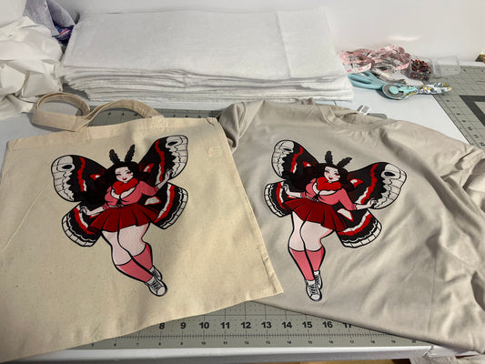 Mesmerized by the Mothwoman Tote Bag